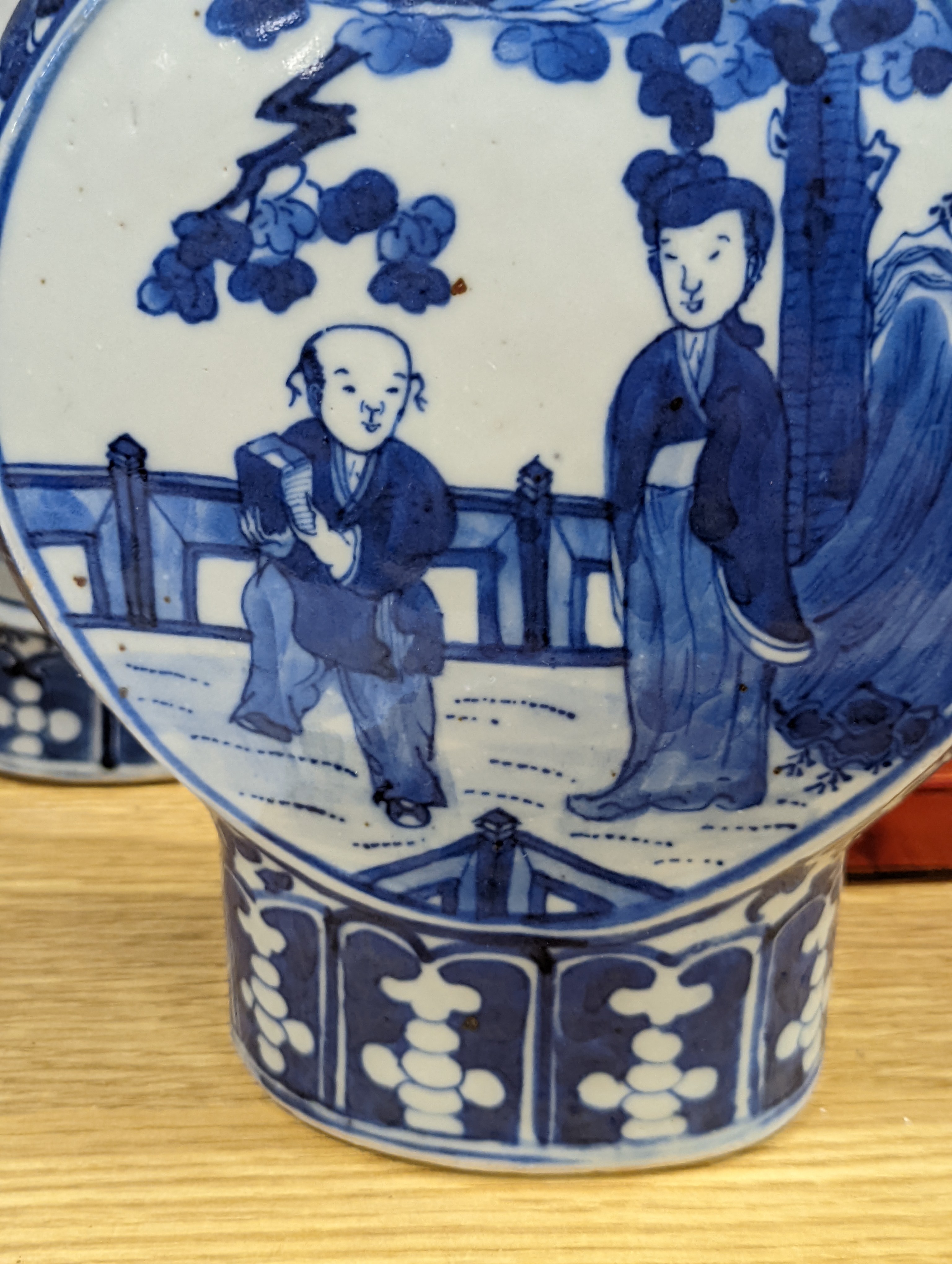 Three 19th century Chinese blue and white Moon flasks, tallest 31 cms.